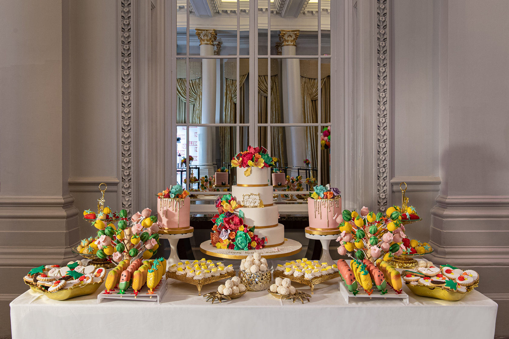 A colourful Indulgence Bar® dessert table for Andrea Mclean's 50th Birthday party at The Langham